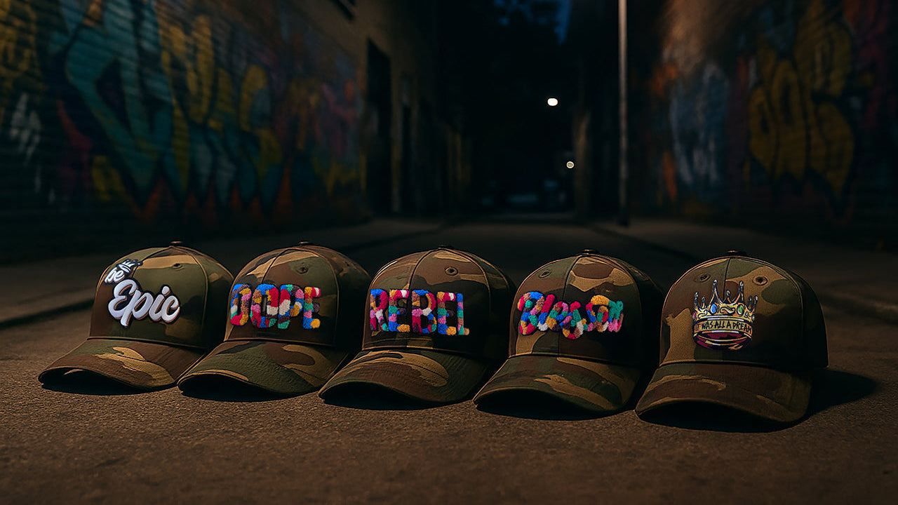Five green caps with colorful text on a dark street background