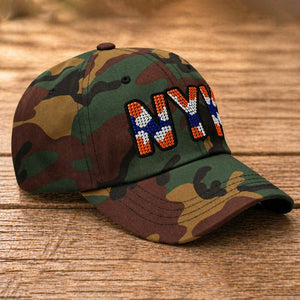 Left side view of camouflage New York rhinestone baseball hat with orange, blue, and silver crystal lettering - Rebel P Customs