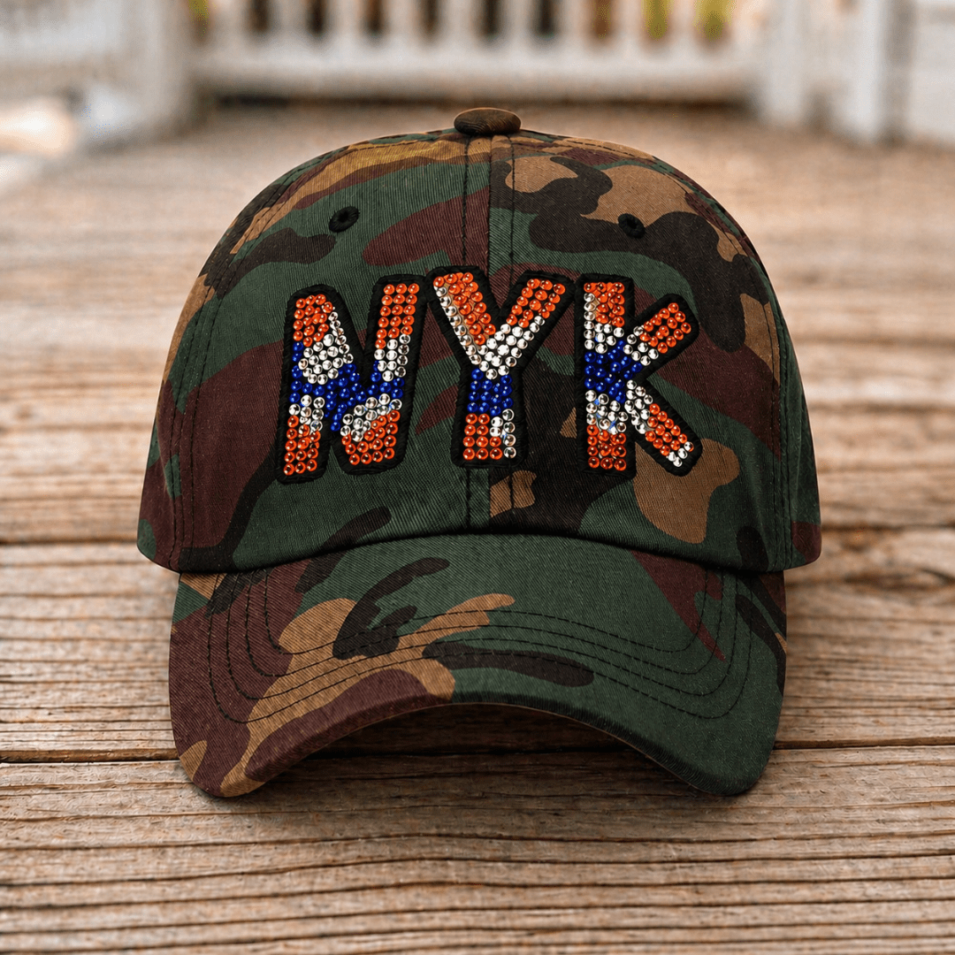 Front view of camouflage New York rhinestone baseball hat with orange, blue, and silver crystal lettering - Rebel P Customs